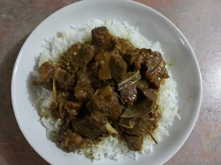 curry duck Trinidad style with white rice